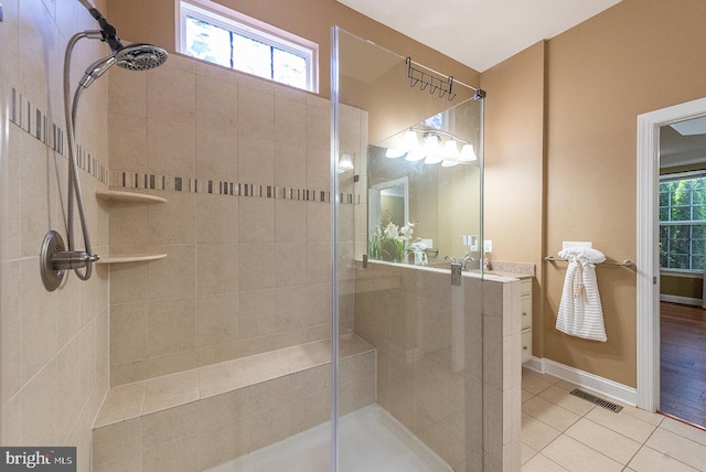 24129 Statesboro Pl, Ashburn, VA 20148 - full bathroom featuring visible vents, tile patterned floors, tiled shower, and vanity