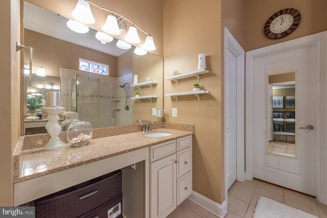 24129 Statesboro Pl, Ashburn, VA 20148 - full bath featuring vanity, tile patterned flooring, and tiled shower