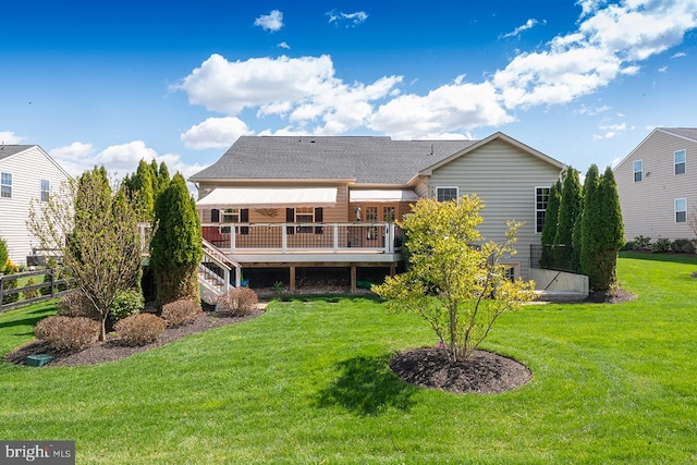 24129 Statesboro Pl, Ashburn, VA 20148 - rear view of house featuring a lawn, fence, a deck, and a shingled roof
