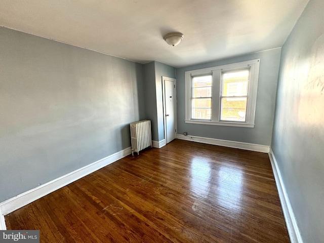 2921 Hale St, Philadelphia, PA 19149 - unfurnished room featuring baseboards, radiator heating unit, and wood finished floors