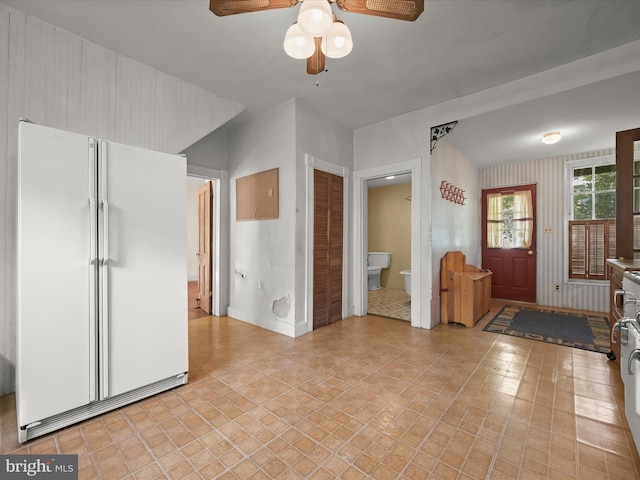 113 Ingleside Ave, Baltimore, MD 21228 - unfurnished living room featuring ceiling fan, light tile patterned floors, and baseboards