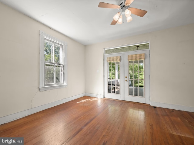 113 Ingleside Ave, Baltimore, MD 21228 - empty room featuring french doors, healthy amount of natural light, and baseboards