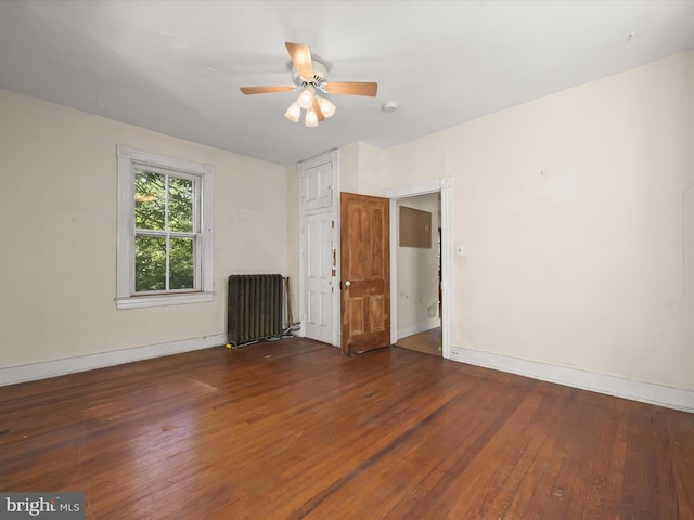 113 Ingleside Ave, Baltimore, MD 21228 - spare room with radiator, wood-type flooring, ceiling fan, and baseboards