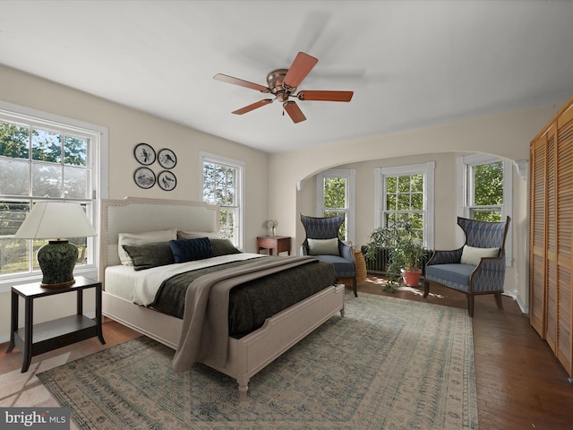 113 Ingleside Ave, Baltimore, MD 21228 - bedroom with arched walkways, wood finished floors, a closet, and ceiling fan