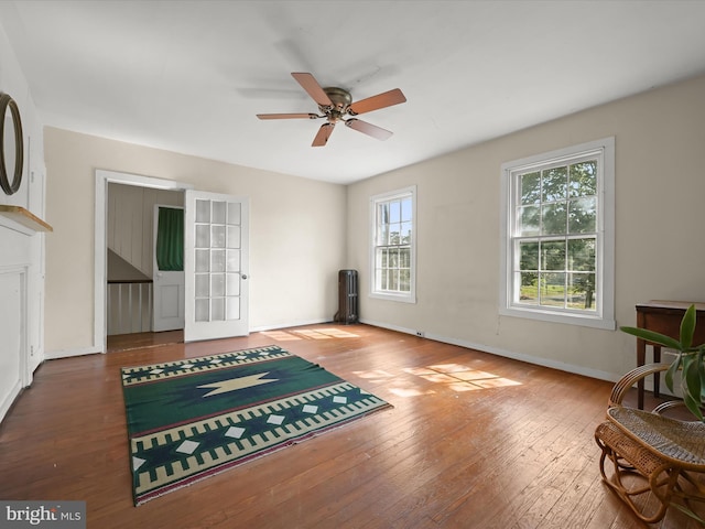 113 Ingleside Ave, Baltimore, MD 21228 - living area with wood-type flooring, a ceiling fan, radiator heating unit, and baseboards