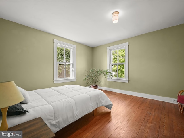 113 Ingleside Ave, Baltimore, MD 21228 - bedroom featuring wood-type flooring, baseboards, and multiple windows