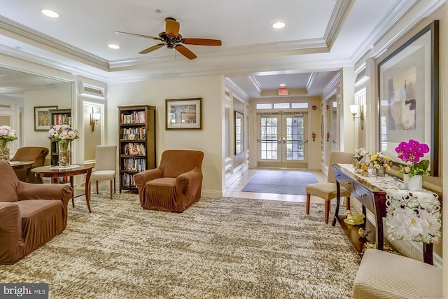 sitting room featuring crown molding, baseboards, ceiling fan, and french doors