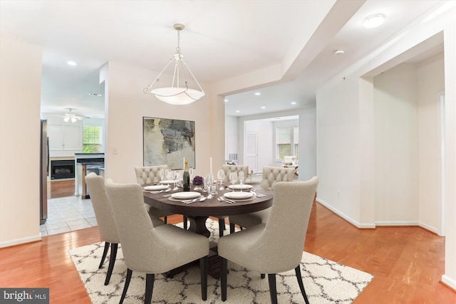 dining room featuring recessed lighting, ceiling fan, baseboards, and light wood finished floors