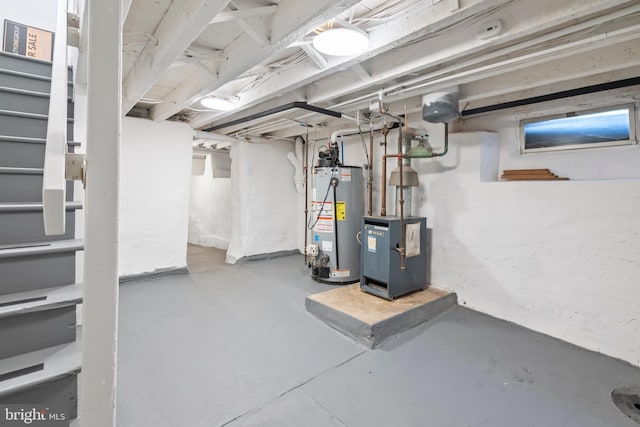 unfinished basement featuring water heater and a heating unit