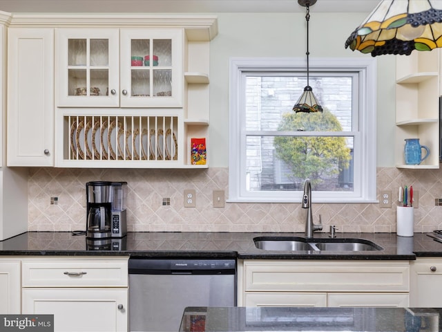 kitchen featuring stainless steel dishwasher, a sink, dark stone counters, glass insert cabinets, and open shelves