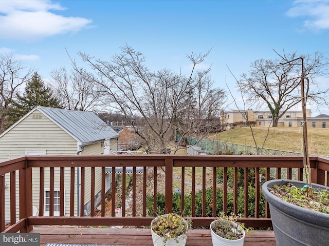 wooden terrace featuring a residential view