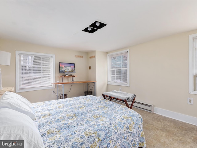 tiled bedroom featuring baseboards and multiple windows