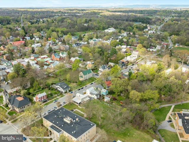 birds eye view of property with a residential view