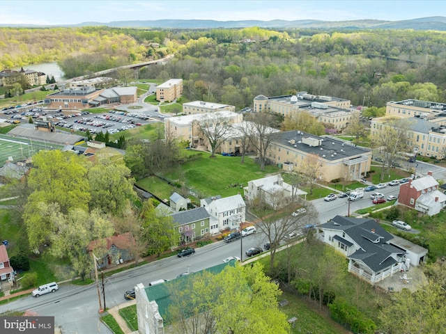 bird's eye view featuring a wooded view