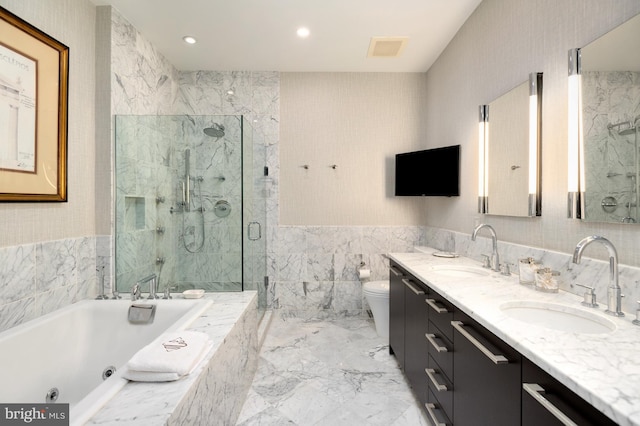 2501 Pennsylvania Ave NW Unit 2A, Washington, DC 20037 - bathroom featuring tile walls, a marble finish shower, a whirlpool tub, double vanity, and toilet