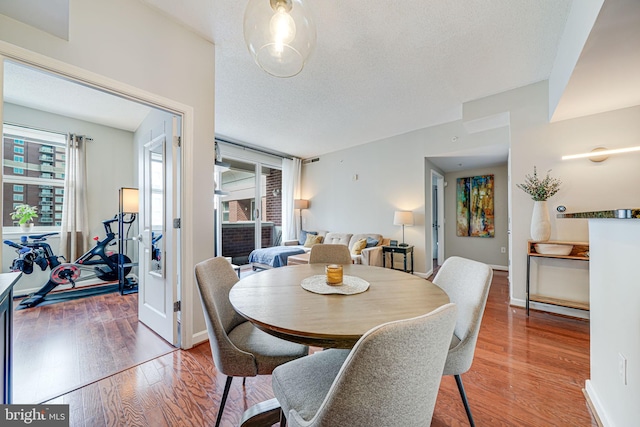 880 N Pollard St Unit 1021, Arlington, VA 22203 - dining area featuring wood finished floors and baseboards