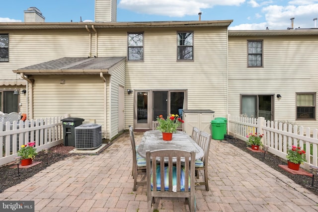9 Stratton Ct, Robbinsville, NJ 08691 - rear view of house with a patio area, central AC, a chimney, and fence