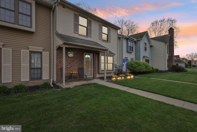 9 Stratton Ct, Robbinsville, NJ 08691 - view of front facade with brick siding and a yard