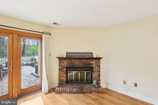 9 Stratton Ct, Robbinsville, NJ 08691 - unfurnished living room with baseboards, wood finished floors, and visible vents
