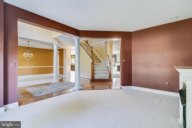 1005 Chaff Way, La Plata, MD 20646 - unfurnished living room with carpet flooring, baseboards, decorative columns, a fireplace, and stairs