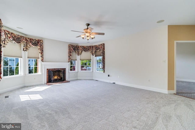 1005 Chaff Way, La Plata, MD 20646 - unfurnished living room featuring baseboards, a ceiling fan, a fireplace, and carpet flooring
