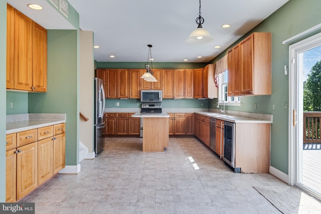 1005 Chaff Way, La Plata, MD 20646 - kitchen with stainless steel appliances, light countertops, a kitchen island, and baseboards