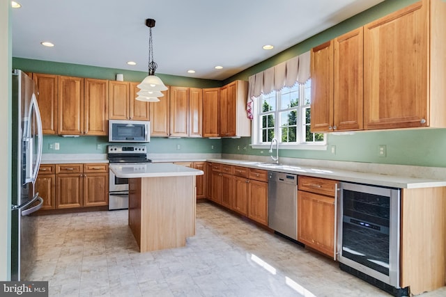 1005 Chaff Way, La Plata, MD 20646 - kitchen featuring a sink, a center island, light countertops, appliances with stainless steel finishes, and beverage cooler