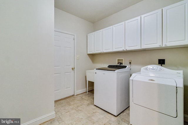 1005 Chaff Way, La Plata, MD 20646 - washroom featuring cabinet space, washing machine and clothes dryer, and baseboards