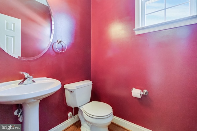 1005 Chaff Way, La Plata, MD 20646 - half bathroom with wood finished floors, toilet, and baseboards