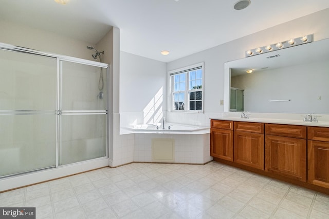 1005 Chaff Way, La Plata, MD 20646 - full bath with a sink, a bath, a stall shower, double vanity, and visible vents