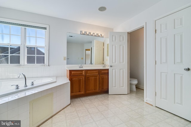 1005 Chaff Way, La Plata, MD 20646 - bathroom with a sink, double vanity, visible vents, toilet, and a bath