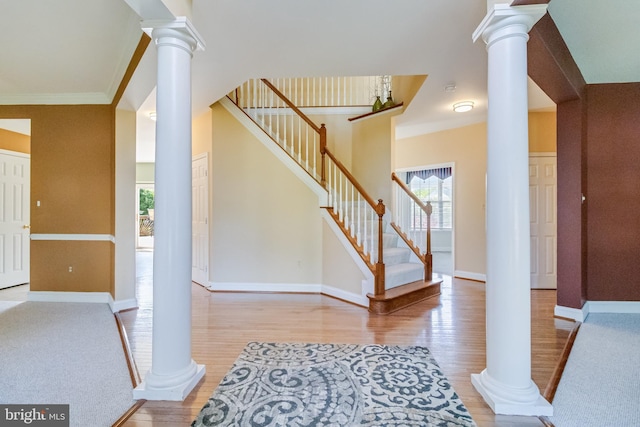 1005 Chaff Way, La Plata, MD 20646 - foyer entrance with baseboards, ornate columns, wood finished floors, and stairs