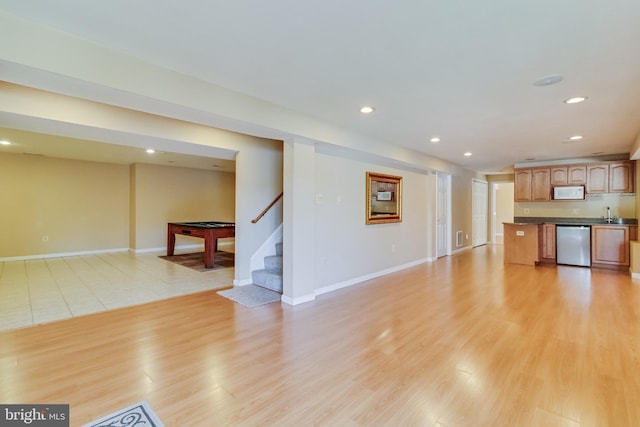1005 Chaff Way, La Plata, MD 20646 - unfurnished living room with recessed lighting, indoor wet bar, stairway, and light wood-type flooring