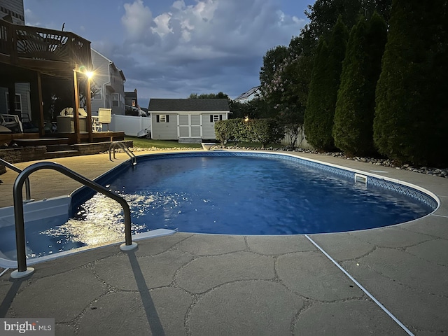 1005 Chaff Way, La Plata, MD 20646 - view of pool featuring a patio area, an outbuilding, a fenced in pool, a storage shed, and fence