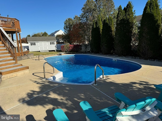 1005 Chaff Way, La Plata, MD 20646 - view of pool with stairs, a patio, a storage unit, an outbuilding, and fence