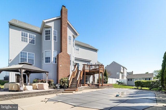 1005 Chaff Way, La Plata, MD 20646 - back of house with stairs, a patio, a wooden deck, a chimney, and a gazebo