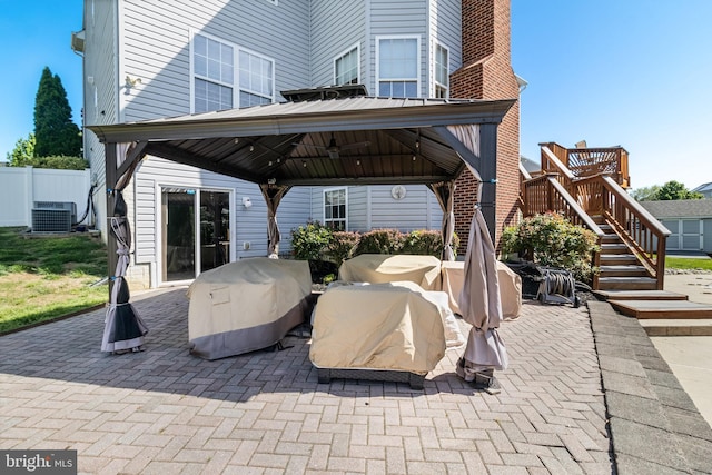 1005 Chaff Way, La Plata, MD 20646 - view of patio featuring stairway, a grill, central AC, a gazebo, and fence