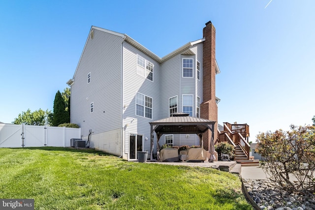 1005 Chaff Way, La Plata, MD 20646 - rear view of house with a gate, a lawn, a chimney, a gazebo, and fence