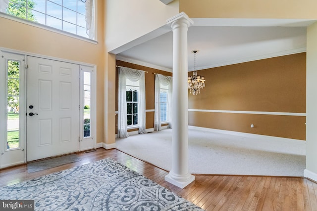 1005 Chaff Way, La Plata, MD 20646 - foyer entrance with ornate columns, a chandelier, visible vents, baseboards, and hardwood / wood-style floors
