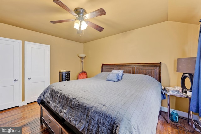 1386 Pentwood Rd, Baltimore, MD 21239 - bedroom with hardwood / wood-style flooring, baseboards, a ceiling fan, and vaulted ceiling