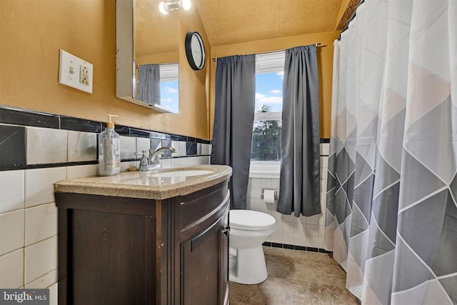 1386 Pentwood Rd, Baltimore, MD 21239 - full bath with tile patterned flooring, a wainscoted wall, toilet, vanity, and tile walls