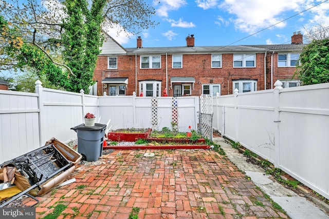 1386 Pentwood Rd, Baltimore, MD 21239 - view of patio featuring a fenced backyard