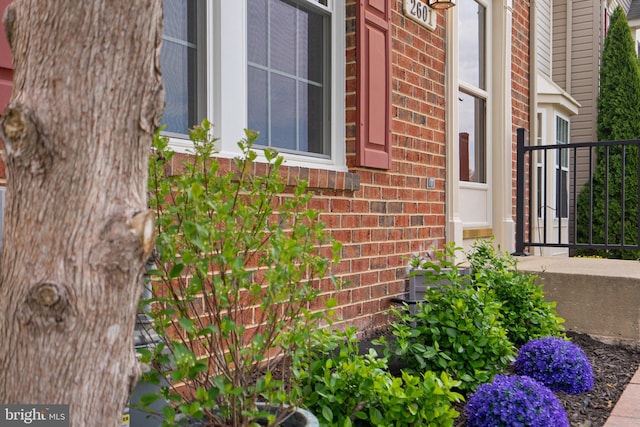 view of property exterior featuring brick siding