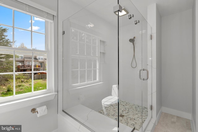 full bath featuring a healthy amount of sunlight and a stall shower