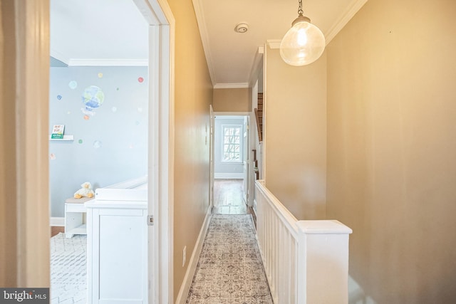 corridor featuring crown molding, an upstairs landing, and baseboards