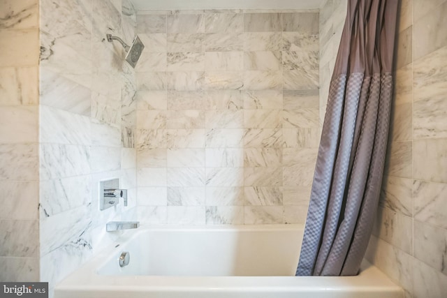 bathroom featuring shower / bathtub combination with curtain