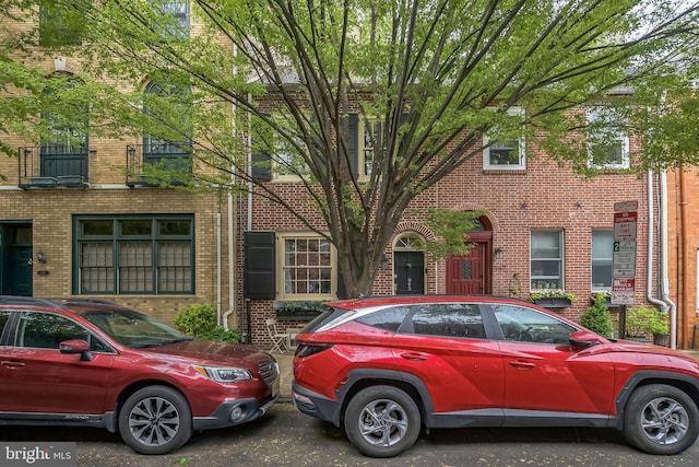 multi unit property featuring brick siding