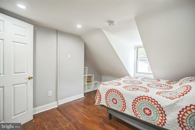 bedroom with wood-type flooring, recessed lighting, and vaulted ceiling
