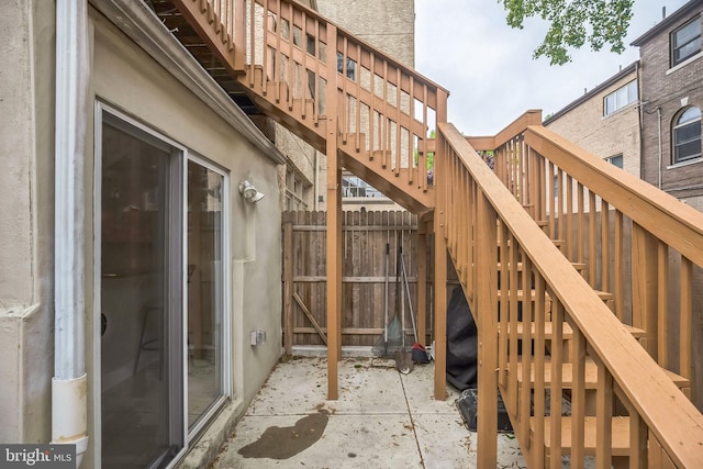 view of patio / terrace with stairs and fence