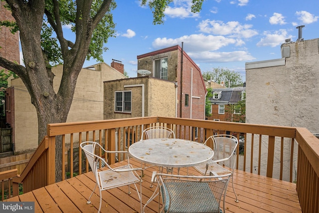 wooden deck featuring outdoor dining space